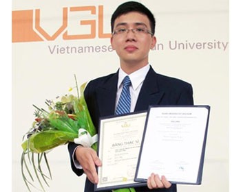 Nguyen Binh Duong holding his master’s degree after a ceremony hosted by the Vietnamese German University